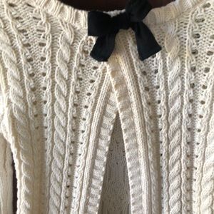 Crocheted sweater w/black bow open back